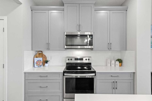 79 Mist Mountain Rise, Okotoks, AB - Indoor Photo Showing Kitchen With Upgraded Kitchen