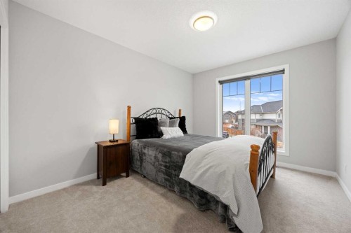 79 Mist Mountain Rise, Okotoks, AB - Indoor Photo Showing Bedroom