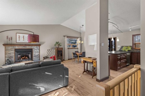 100 Settler Way, Canmore, AB - Indoor Photo Showing Living Room With Fireplace