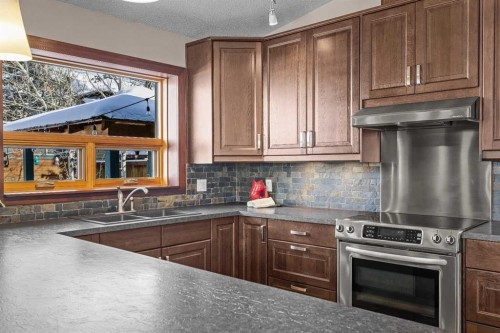 100 Settler Way, Canmore, AB - Indoor Photo Showing Kitchen With Double Sink