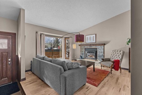 100 Settler Way, Canmore, AB - Indoor Photo Showing Living Room With Fireplace