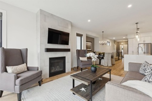 220 Precedence View, Cochrane, AB - Indoor Photo Showing Living Room With Fireplace