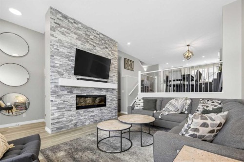 261 Masters Road Se, Calgary, AB - Indoor Photo Showing Living Room With Fireplace