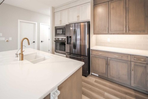 148 Carringham Road Nw, Calgary, AB - Indoor Photo Showing Kitchen With Double Sink With Upgraded Kitchen
