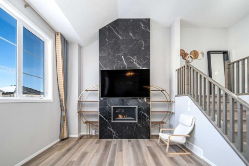 148 Carringham Road Nw, Calgary, AB - Indoor With Fireplace