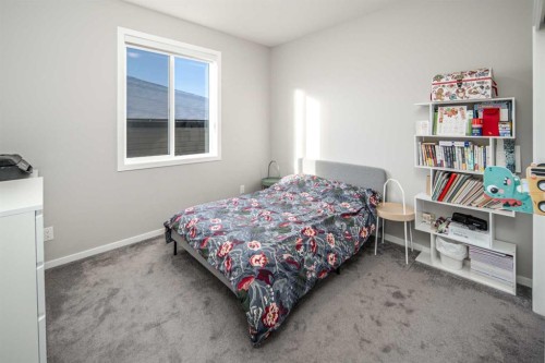 148 Carringham Road Nw, Calgary, AB - Indoor Photo Showing Bedroom
