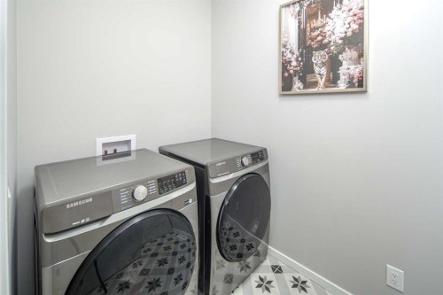 148 Carringham Road Nw, Calgary, AB - Indoor Photo Showing Laundry Room
