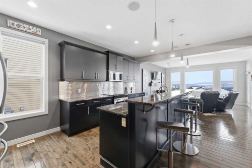 95 Sunset Way, Cochrane, AB - Indoor Photo Showing Kitchen With Upgraded Kitchen