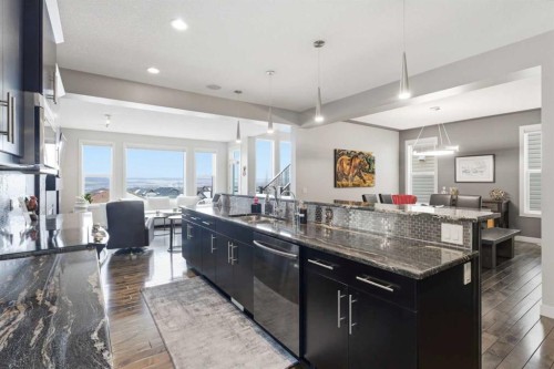 95 Sunset Way, Cochrane, AB - Indoor Photo Showing Kitchen With Upgraded Kitchen