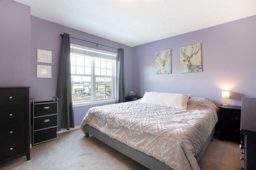 1074 Panatella Boulevard Nw, Calgary, AB - Indoor Photo Showing Bedroom