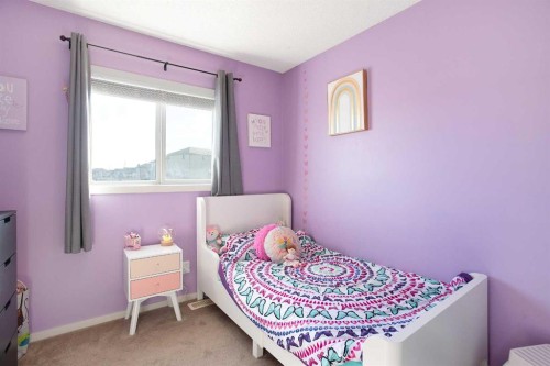 1074 Panatella Boulevard Nw, Calgary, AB - Indoor Photo Showing Bedroom