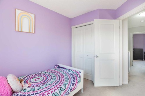 1074 Panatella Boulevard Nw, Calgary, AB - Indoor Photo Showing Bedroom