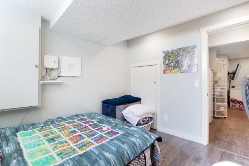 1074 Panatella Boulevard Nw, Calgary, AB - Indoor Photo Showing Bedroom