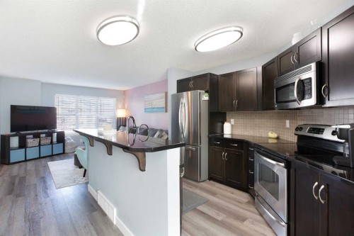 1074 Panatella Boulevard Nw, Calgary, AB - Indoor Photo Showing Kitchen With Upgraded Kitchen