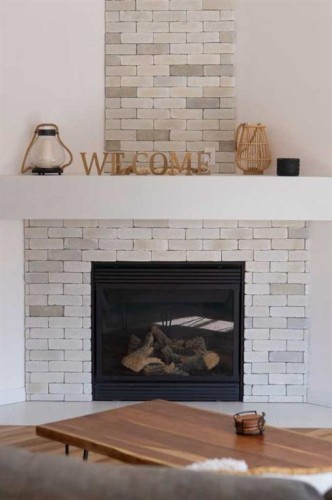 282 Chapalina Terrace Se, Calgary, AB - Indoor Photo Showing Living Room With Fireplace