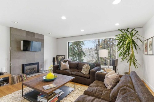 2910 Marquette Street Sw, Calgary, AB - Indoor Photo Showing Living Room With Fireplace