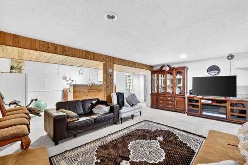 236 Mckerrell Way Se, Calgary, AB - Indoor Photo Showing Living Room