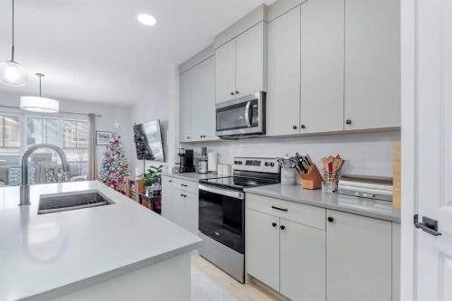 371 Fireside Way, Cochrane, AB - Indoor Photo Showing Kitchen With Double Sink With Upgraded Kitchen