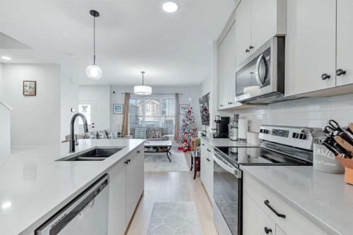 371 Fireside Way, Cochrane, AB - Indoor Photo Showing Kitchen With Stainless Steel Kitchen With Double Sink With Upgraded Kitchen