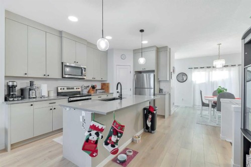 371 Fireside Way, Cochrane, AB - Indoor Photo Showing Kitchen With Stainless Steel Kitchen With Upgraded Kitchen