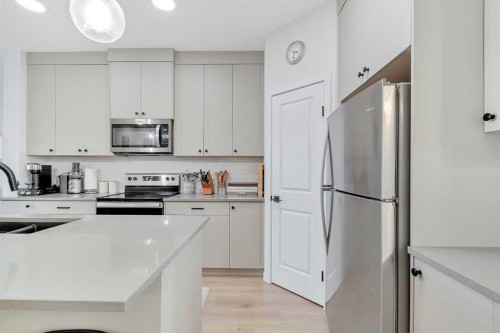 371 Fireside Way, Cochrane, AB - Indoor Photo Showing Kitchen With Stainless Steel Kitchen