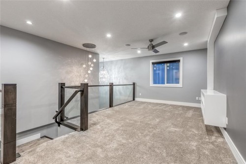 302 Kinniburgh Rd, Chestermere, AB - Indoor Photo Showing Other Room