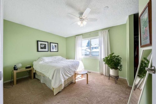 50 Cedarwood Rise Sw, Calgary, AB - Indoor Photo Showing Bedroom