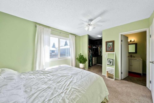 50 Cedarwood Rise Sw, Calgary, AB - Indoor Photo Showing Bedroom