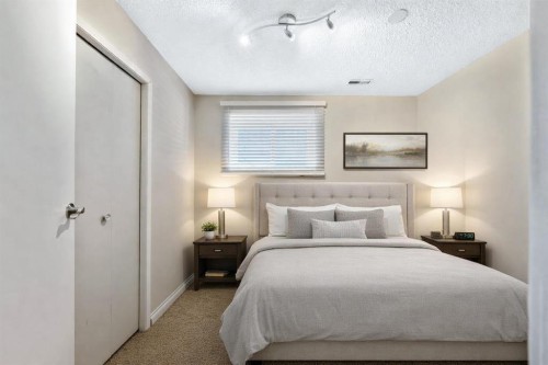 50 Cedarwood Rise Sw, Calgary, AB - Indoor Photo Showing Bedroom