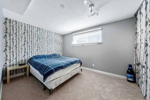 50 Cedarwood Rise Sw, Calgary, AB - Indoor Photo Showing Bedroom