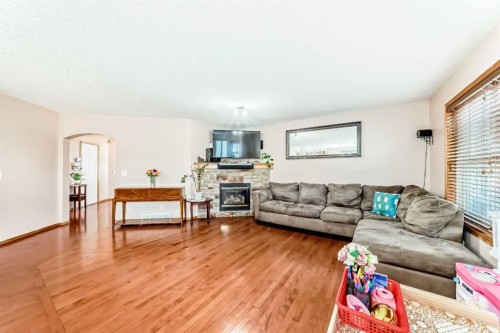 16062 Everstone Road Sw, Calgary, AB - Indoor Photo Showing Living Room With Fireplace