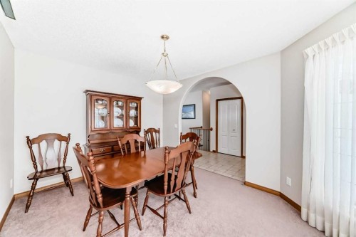 220 Rocky Ridge Villas Nw, Calgary, AB - Indoor Photo Showing Dining Room