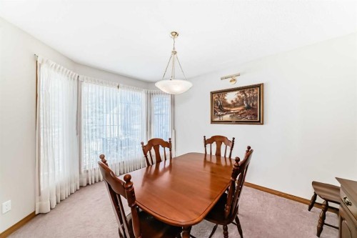 220 Rocky Ridge Villas Nw, Calgary, AB - Indoor Photo Showing Dining Room