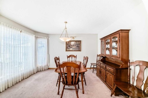 220 Rocky Ridge Villas Nw, Calgary, AB - Indoor Photo Showing Dining Room