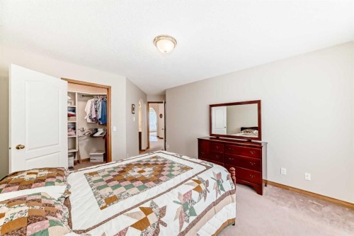 220 Rocky Ridge Villas Nw, Calgary, AB - Indoor Photo Showing Bedroom
