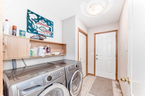 220 Rocky Ridge Villas Nw, Calgary, AB - Indoor Photo Showing Laundry Room