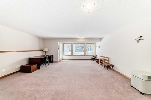 220 Rocky Ridge Villas Nw, Calgary, AB - Indoor Photo Showing Other Room