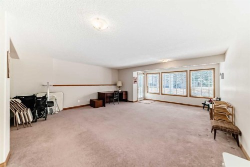 220 Rocky Ridge Villas Nw, Calgary, AB - Indoor Photo Showing Other Room