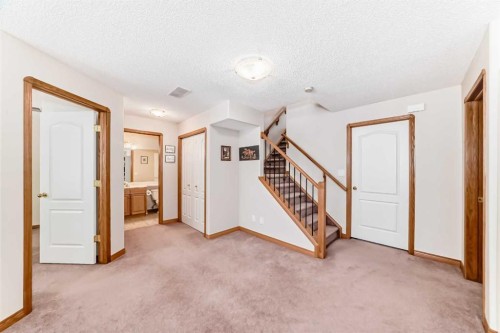 220 Rocky Ridge Villas Nw, Calgary, AB - Indoor Photo Showing Other Room