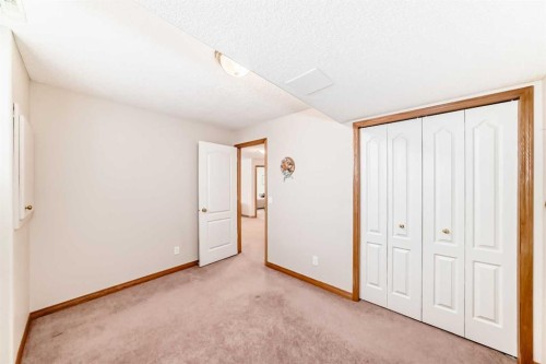 220 Rocky Ridge Villas Nw, Calgary, AB - Indoor Photo Showing Other Room