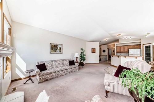 220 Rocky Ridge Villas Nw, Calgary, AB - Indoor Photo Showing Living Room