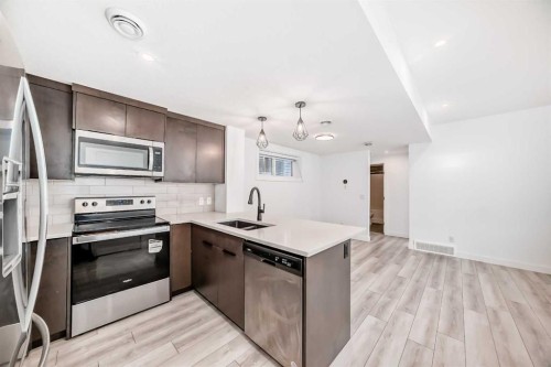 357 Calhoun Common Ne, Calgary, AB - Indoor Photo Showing Kitchen With Double Sink