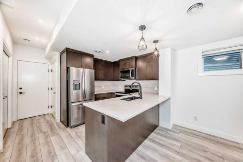 357 Calhoun Common Ne, Calgary, AB - Indoor Photo Showing Kitchen With Double Sink