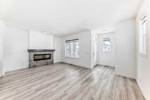 357 Calhoun Common Ne, Calgary, AB - Indoor Photo Showing Living Room With Fireplace