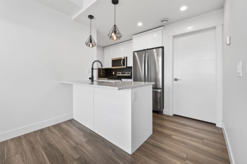 214 Seton Passage Se, Calgary, AB - Indoor Photo Showing Kitchen With Upgraded Kitchen