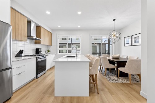 10 Currie Walk Sw, Calgary, AB - Indoor Photo Showing Kitchen With Stainless Steel Kitchen With Upgraded Kitchen
