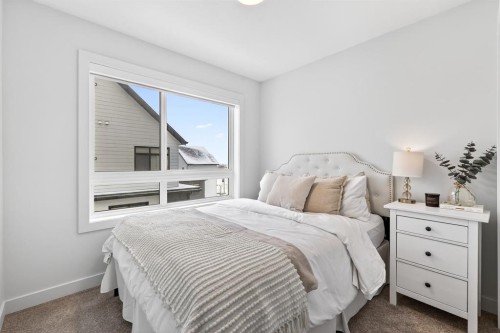 10 Currie Walk Sw, Calgary, AB - Indoor Photo Showing Bedroom
