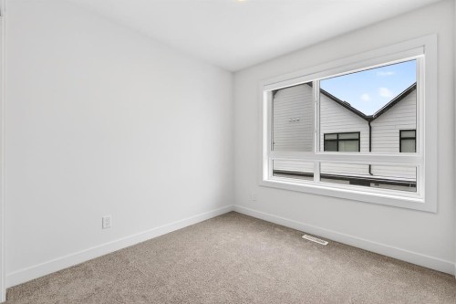 10 Currie Walk Sw, Calgary, AB - Indoor Photo Showing Other Room