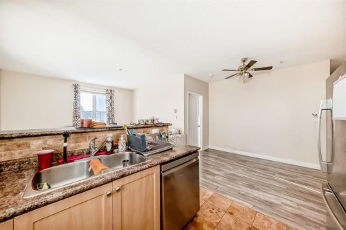 2202-333 Taravista Drive Ne, Calgary, AB - Indoor Photo Showing Kitchen With Double Sink