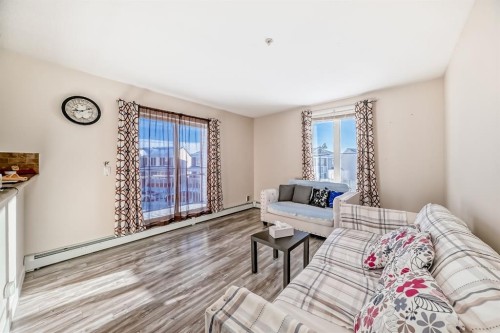 2202-333 Taravista Drive Ne, Calgary, AB - Indoor Photo Showing Living Room